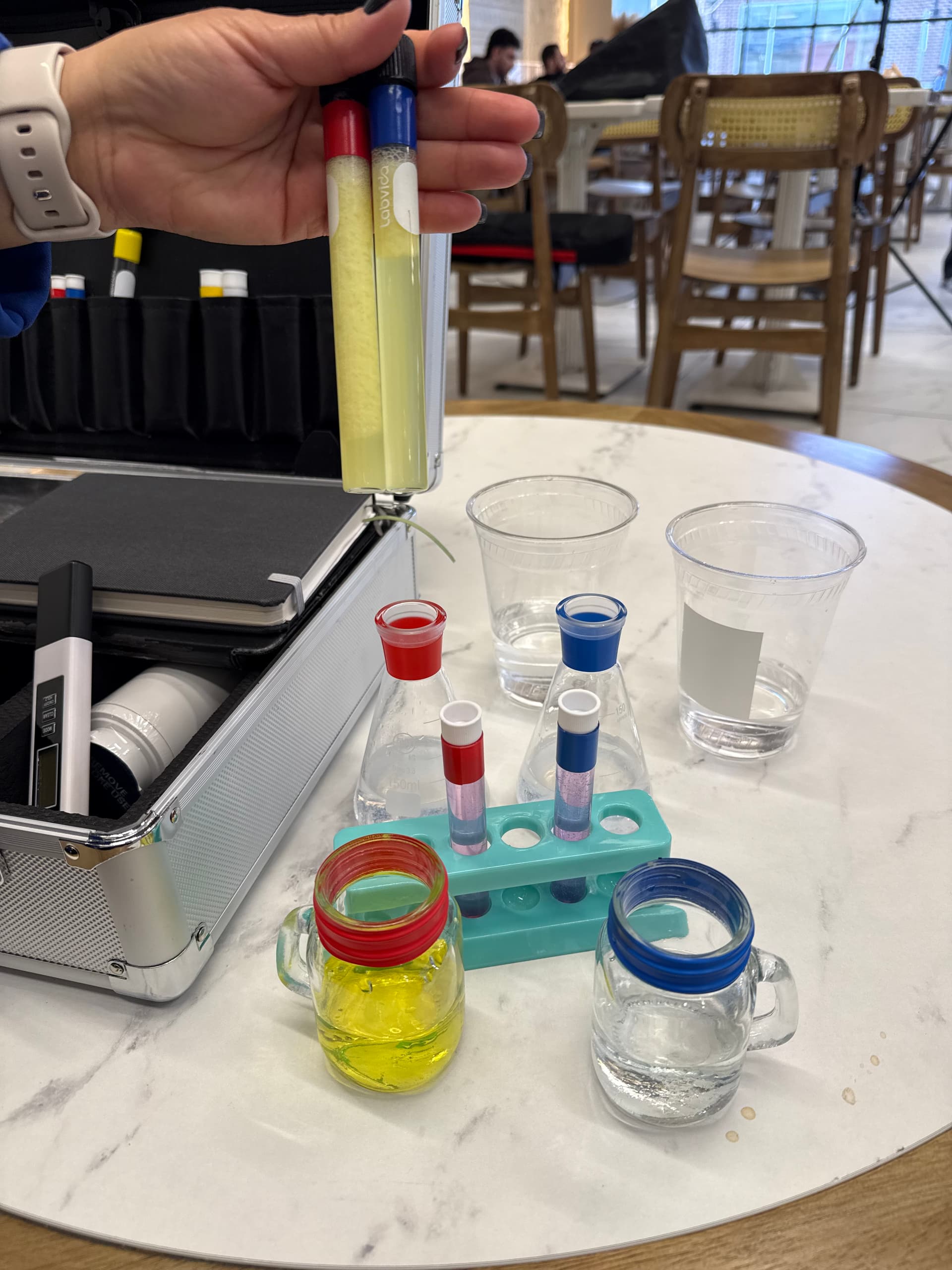 Aquafeel technician demonstrating water quality testing in a customer's home