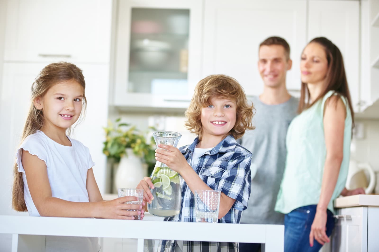 Family enjoying clean water in their kitchen
