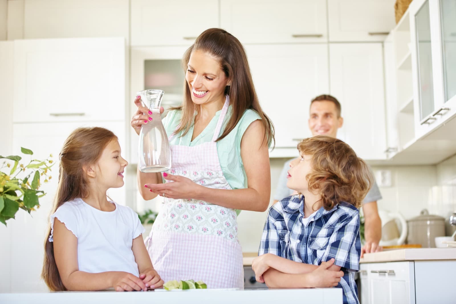 Family enjoying clean water in kitchen
