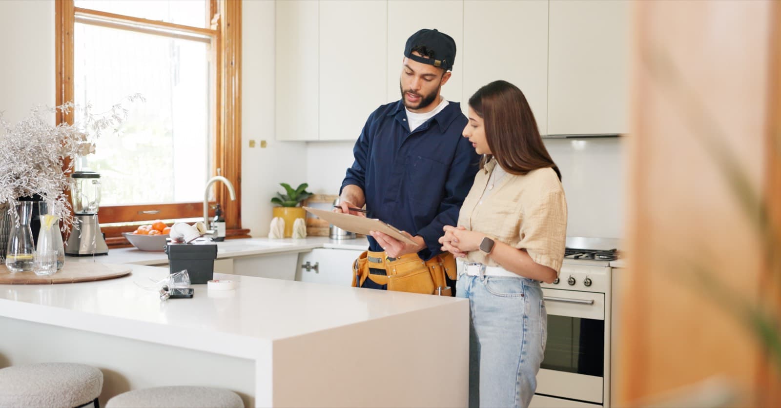 Technician showing water test results to homeowner